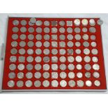 A tray containing a selection of silver and cupro nickel 3d coins and sixpences