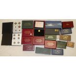 A large selection of various empty coin boxes, proof coin set boxes and others,