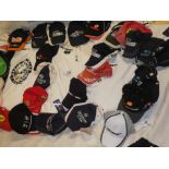 A large selection of Formula 1 related caps and clothing including Ferrari, Red Bull, Caterham,