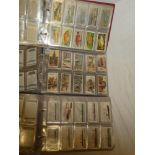 Three albums of sets and part sets of cigarette cards including Ogden's - Smugglers and Smuggling;