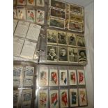 Three albums containing various part sets of cigarette cards including Ogden's - British Costumes;