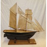 An old wooden model two-masted sailing boat 30" long