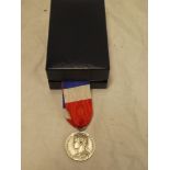 A Republic of France Ministere du Travail medal awarded to S Guerin 1981 in original box with