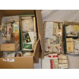A box containing various part sets of cigarette cards