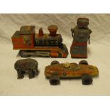 A Marx Toys tin plate clockwork elephant, Japanese tin plate robot,