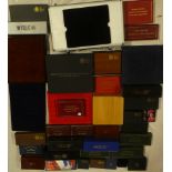 A large selection of various coin boxes, empty presentation coin cases, aluminium coin briefcase,