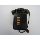 A black painted wooden cased push button telephone, 5 buttons,