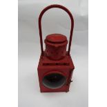 A B.R. (Sc) red painted tall lamp, reservoir minus wick