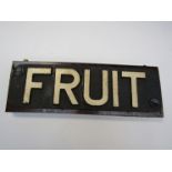 A wooden panel mounted cast iron Goods Wagon 'Fruit' sign,