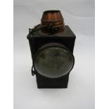 A square painted signal lamp reservoir and burner and brass chimney,