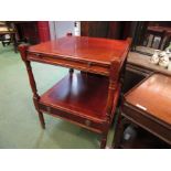 A mahogany two tier lamp table with brushing slide over a base drawer,