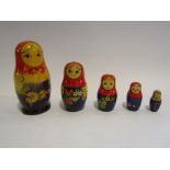 Five wooden handcrafted Russian dolls