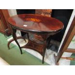 An Edwardian inlaid mahogany oval top two tier lamp table,