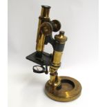 A Ross of London brass lacquered "Eclipse" microscope with lenses in wooden box