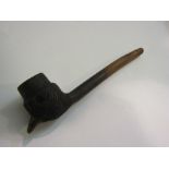A composition smoking pipe in the form of a bird