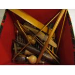 A box of treen textile related tools and items including bobbins, knitting needles,