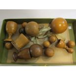 A collection of treen balls and cups