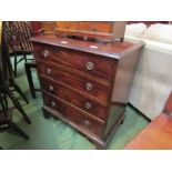 A mahogany diminutive chest of four drawers on bracket feet,