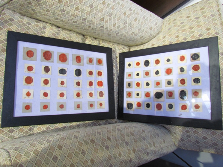 A pair of framed and glazed sets of wax seals