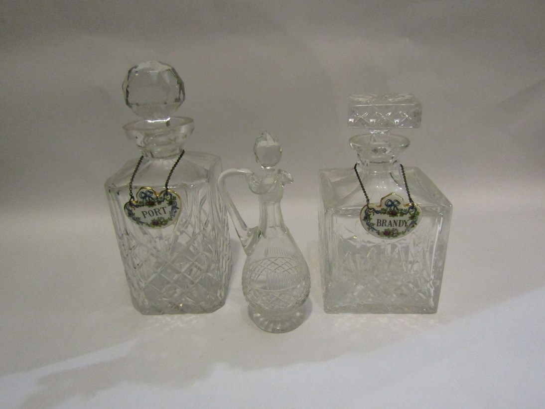 Two heavy glass decanters with ceramic spirit labels and another (3)