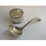 A small silver ladle and napkin ring