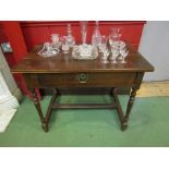 A 17th Century oak single drawer side table,