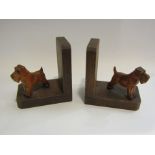 A pair of hardwood bookends in the form of terriers
