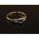 An 18ct gold platinum set sapphire and diamond ring. Size J, 1.