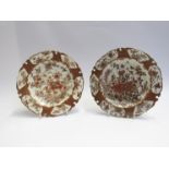 A near pair of 19th Century Kutani plates with shaped rims and all over foliage design,