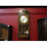 A mid-20th Century wall hanging clock with 3 train movement