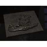 A 19th Century bronze plaque depicting lady reading,