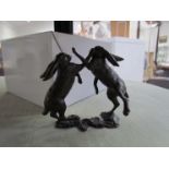 A pair of limited edition bronze boxing hares, boxed with certificate 3/50,