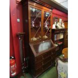 An astragal glazed mahogany bureau bookcase with two short over two long drawers.