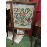 An Edwardian walnut tapestry firescreen,