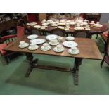 A 20th Century oak trestle table with bulbous supports to stretcher base,