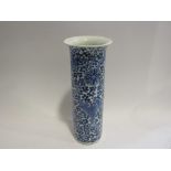A Chinese blue and white prunus cylinder vase with four character marks to base,