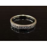 A white gold diamond half hoop ring, stamped 585. Size N, 2.