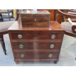 A Regency mahogany miniature chest of three drawers with ring drop handles, one handle loose,