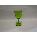 A green vaseline glass goblet,