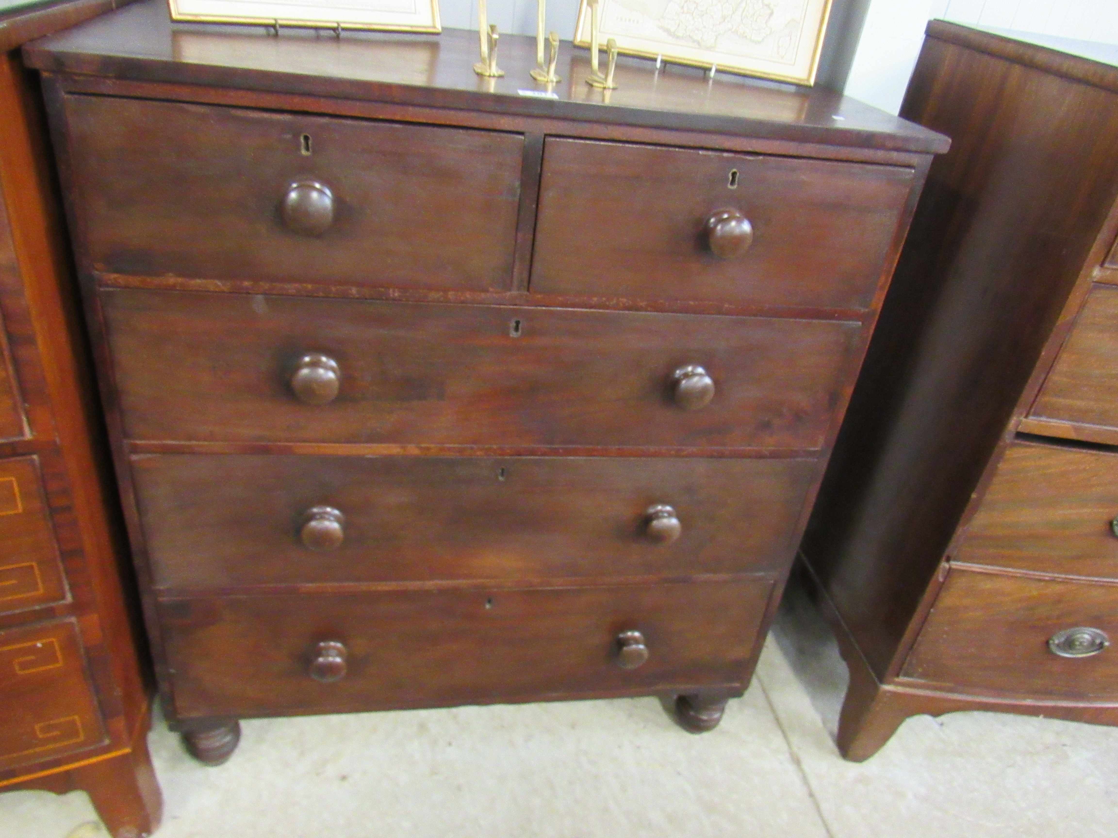 A Victorian mahogany two over three chest of drawers