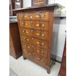 An 18th Century continental inlaid mahogany six graduating drawer tall boy with shell detail,