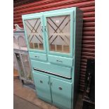 A mid 20th Century painted kitchen cabinet with pull out enamel work top