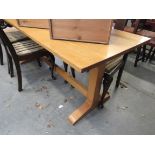 A beech dining table on H form stretcher base,