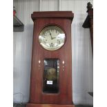 A 1940s mahogany wall hanging 8 day grandmother clock