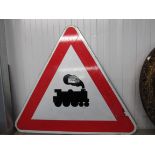 A triangular train road sign