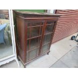 An Edwardian mahogany two door glazed bookcase,