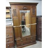 A late Victorian wardrobe with single mirrored door,