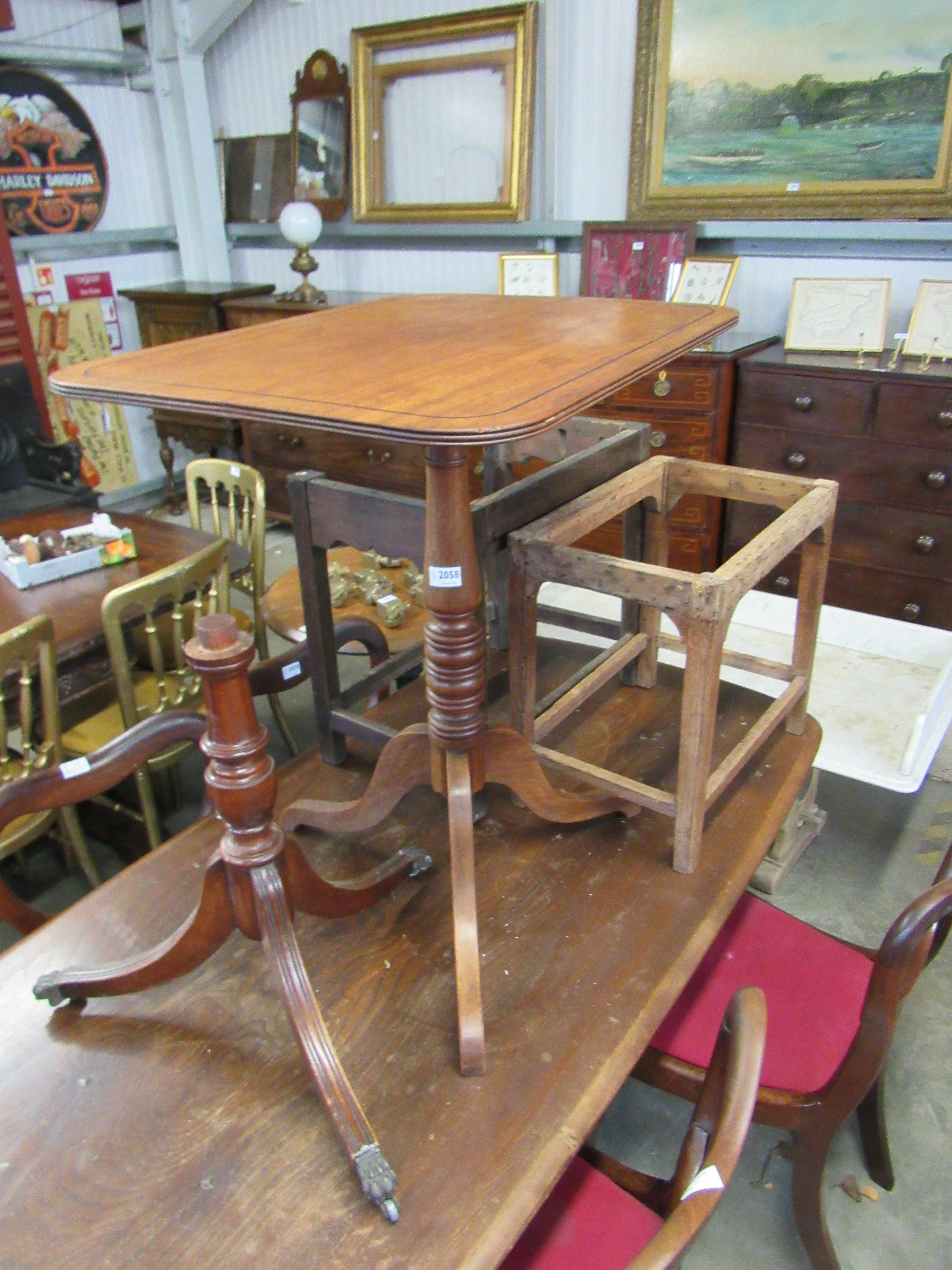 A Georgian mahogany tripod table with ebony line inlay top,