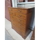 An Edwardian inlaid mahogany gentleman's campaign chest with lift up top to reveal a leather