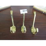 Three brass Art Deco style double coat hooks